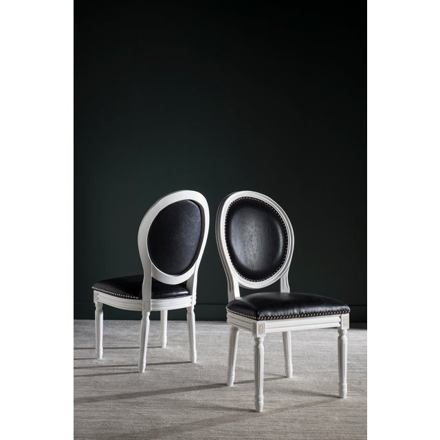 Brim With French country charm, this set of two dining chairs boasts a classic cream frame and practical PU leather...