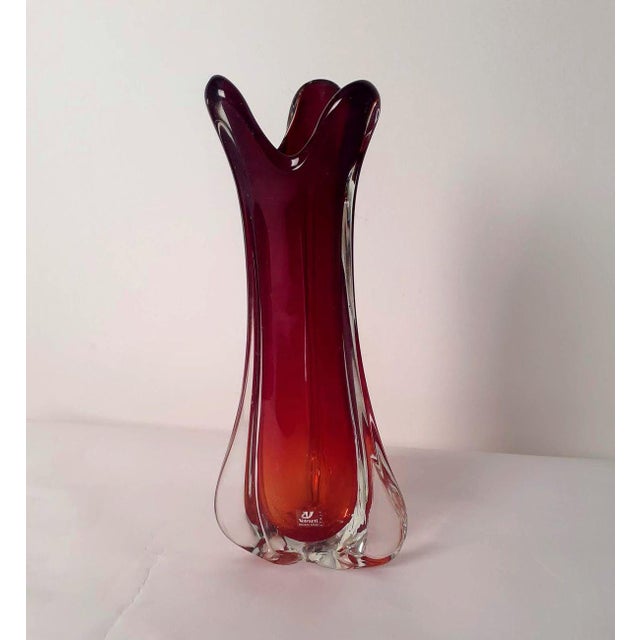Large submerged glass vase with a triangular section in red, dating back to the 1940s, produced by the historic A,ve.m\....