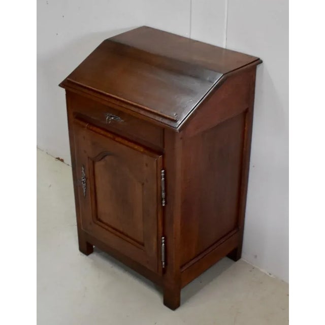 Small furniture in solid oak taste of Louis XIV, forming panel. Indeed, its upper part is made in the front of an inclined...