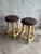 This elegant pair of vintage counter-height stools is executed in the manner of McGuire, showcasing sculptural rattan...