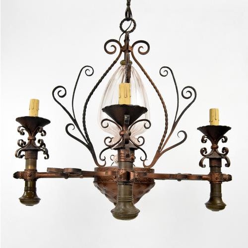 Magnificent bronze chandelier with a glass interior decoration will be an exceptional addition to your home or business...