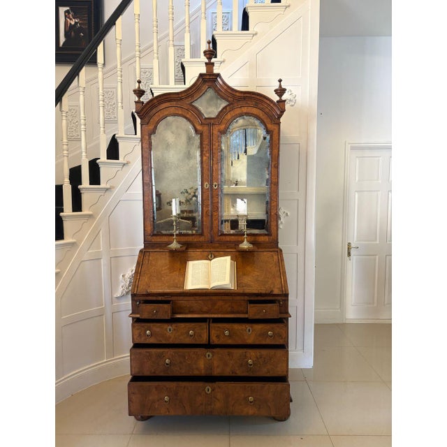 Antique Queen Anne fantastic quality burr walnut and featherbanded bureau bookcase having a shaped moulded top with three...