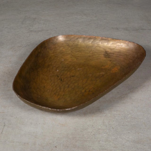 ABOUT A mid-century kidney shaped, hammered copper dish. Stamped "Made in West Berlin". CREATOR Unknown. West Berlin,...