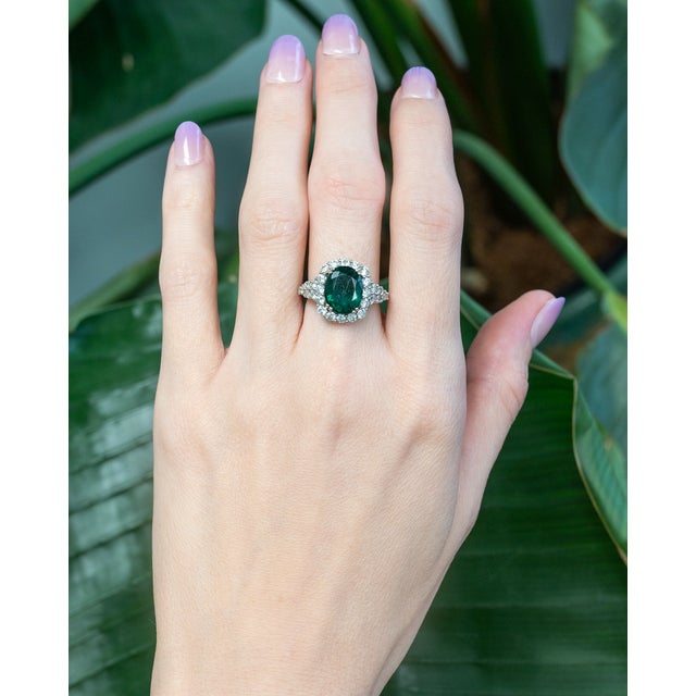 This gorgeous statement ring features a 3-carat emerald gemstone of size 11x9mm with natural earth-mined diamonds, all set...