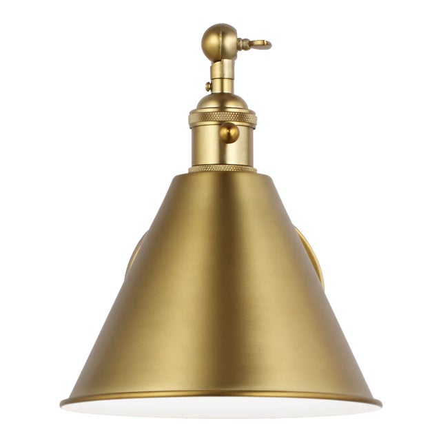 The Salem one light wall sconce in satin brass offers shadow-free lighting in your powder room, spa, or master bath room....