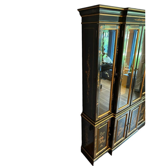 Quick Hits: - Hand-painted black Chinoiserie cabinet with glass panes - Beautiful Asian motifs, featuring floral and bird...