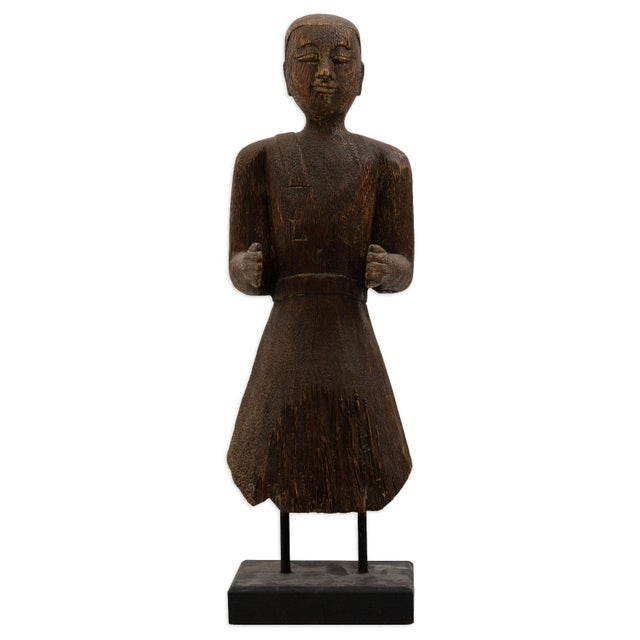 This carved male tribal sculpture brings an earthy, artisan crafted presence to any setting. Fashioned from solid wood, it...