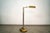 Vintage Midcentury Modern brass floor lamp for sale. The height is adjustable, and the arm swings out. The brass...
