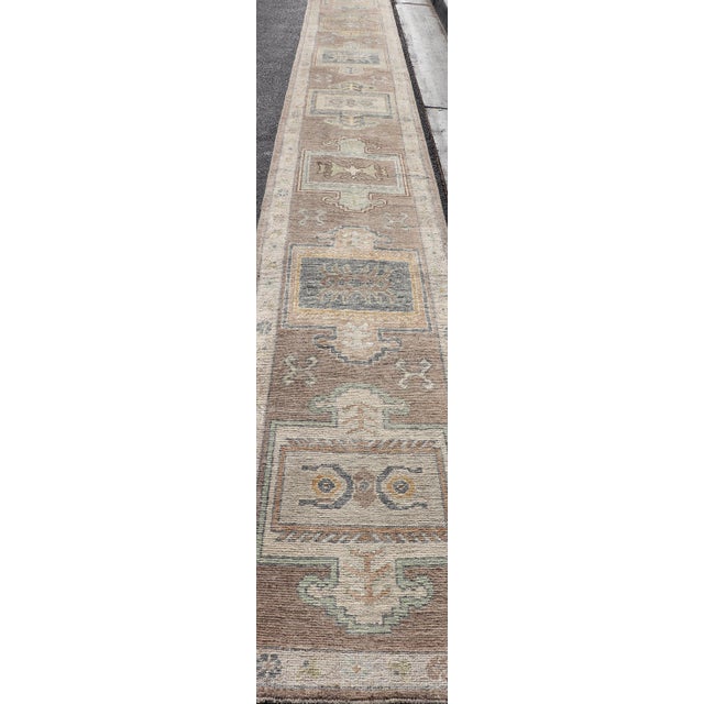 Long Turkish Oushak Runner in Pale Taupe With Blue and Soft Green Motifs For Sale - Image 10 of 12