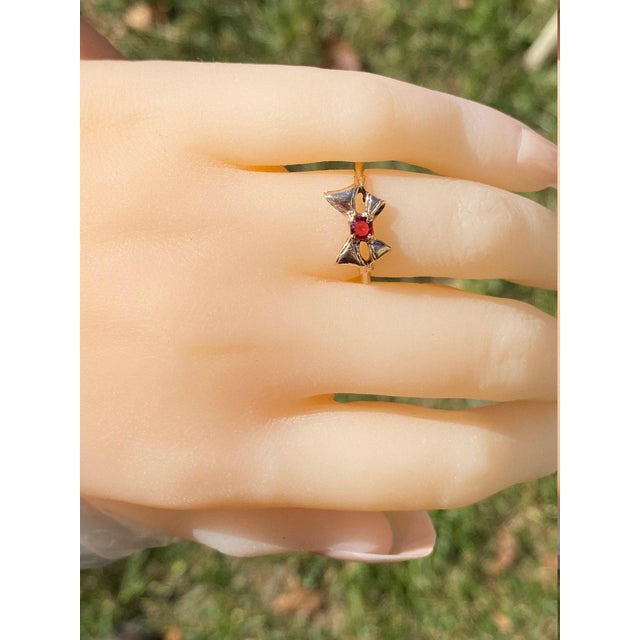 The Fennville Ladies Rose Gold Bow Ring set with Doublet Center. Crafted in trendy rose gold, this Victorian bow ring...