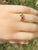The Fennville Ladies Rose Gold Bow Ring set with Doublet Center. Crafted in trendy rose gold, this Victorian bow ring...