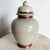 This vintage Japanese porcelain ginger jar exudes timeless elegance with its crackled glaze finish and intricate floral...