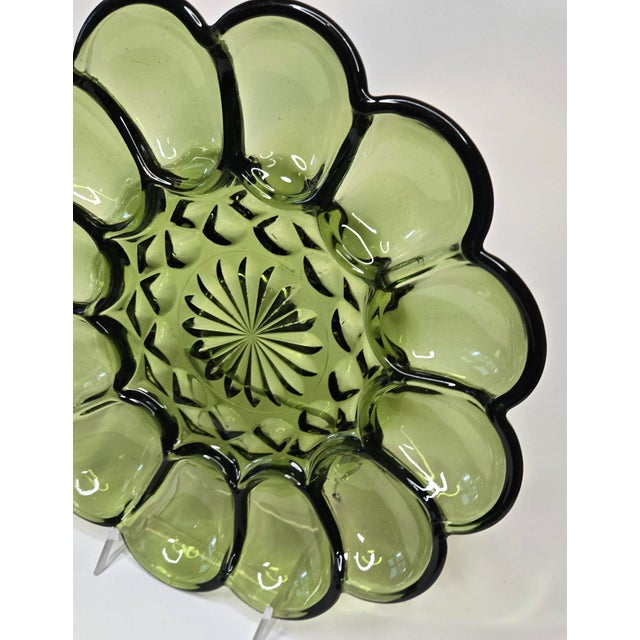 The pivotal mid century avocado green glass pops this Starburst centered egg tray. It's devilishly perfect.