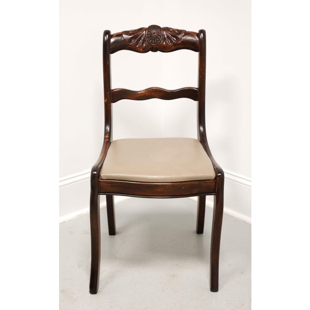 An Empire style armless side chair, unbranded, likely Hickory Manufacturing Co. Solid mahogany with a medallion & leaves...