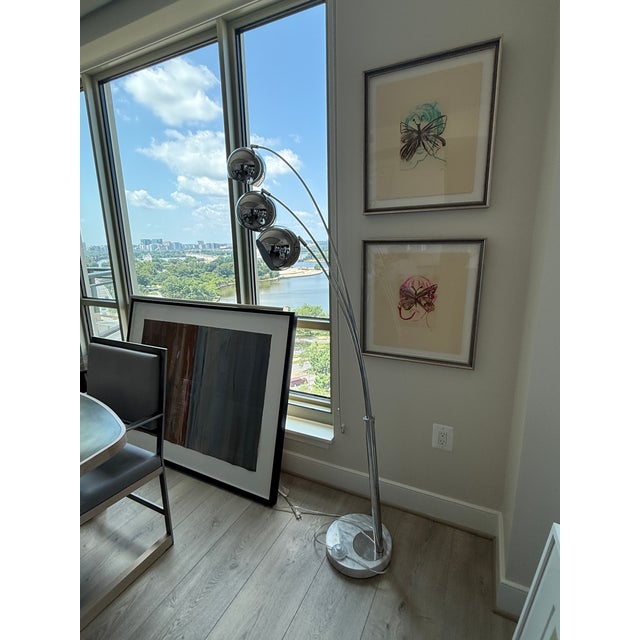 Marble Base 3 Arm Arc Lamp Chrome arms and globes provide a sleek and vertical way to bring light to your room....