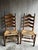 Vintage pair of French Country ladder back chairs with woven rush seats. These chairs stand out for the beautiful wood...