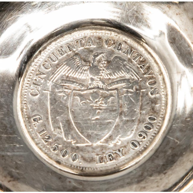 Offering this sterling silver ash receiver with a Republic of Colombia coin. It is footed with 3 mules that are marked...