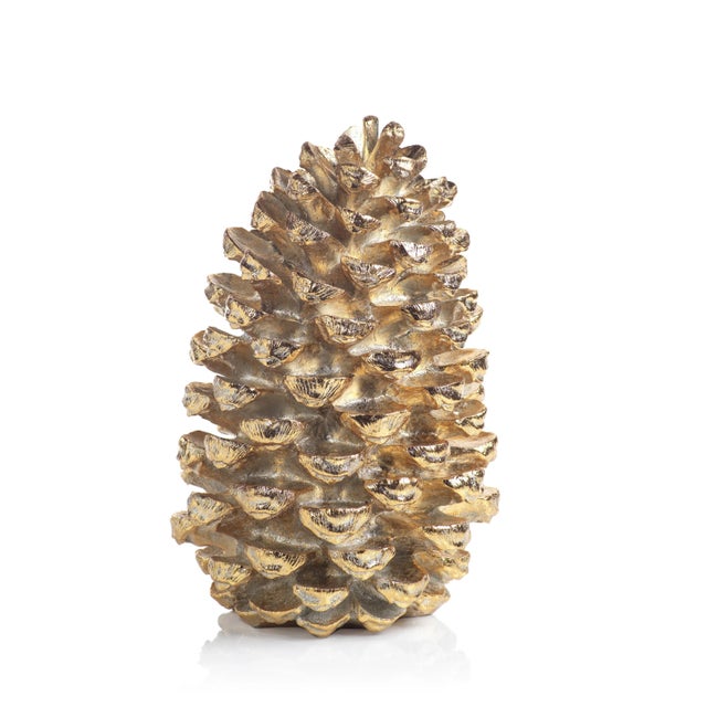 Bring a shimmering touch to your home décor with the Gold Pinecone figurine. This resin conifer cone figurine with gold...