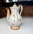 An elegant vintage Meissen porcelain teapot, crafted in fine white porcelain and decorated with delicate hand-painted...