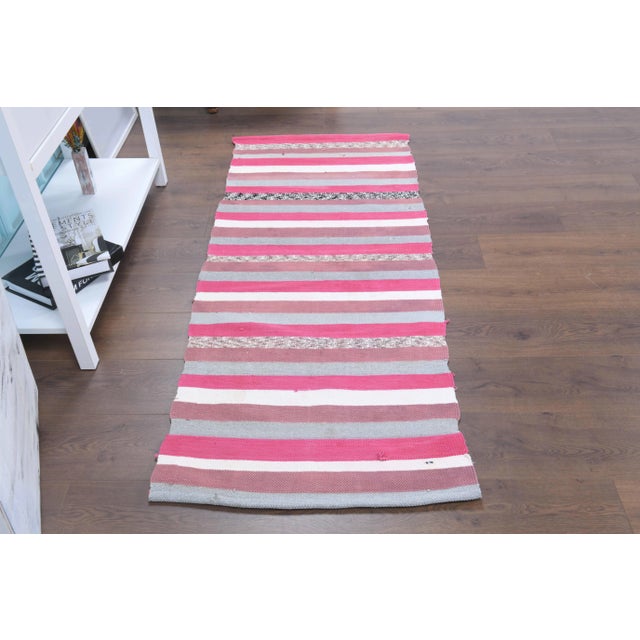 Vintage Turkish Hand-Knotted vintage rug is a semi-Vintage kilim runner rug.'70s Eastern region of Turkey's unique rug is...