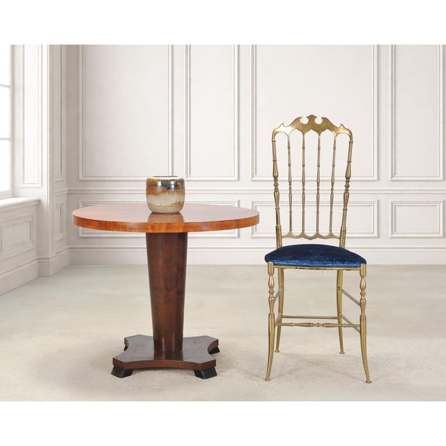 An elegant round American classical center table screen-used in the parlor of Carrie Bradshaw's Gramercy Park, New York...