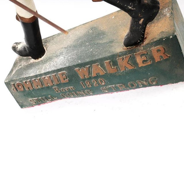 Classic Pub Memorabilia: Johnnie Walker Striding Man A rare vintage advertising statue of the iconic Johnnie Walker...