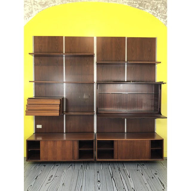 Modular Sheving System by Osvaldo Borsani for Tecno, Italy, 1960, in Good conditions. Designed 1960 to 1969 This piece has...