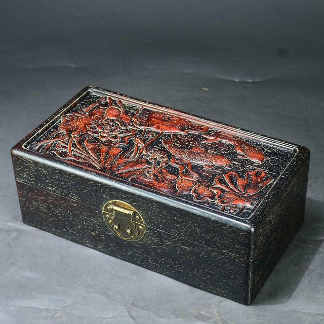 This striking vintage Chinese box is a beautiful example of traditional wood carving. Crafted from dense, dark hardwood...