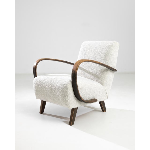Introducing the 1950s Czech Wooden Armchair by J. Halabala, a timeless piece that combines vintage charm with modern...