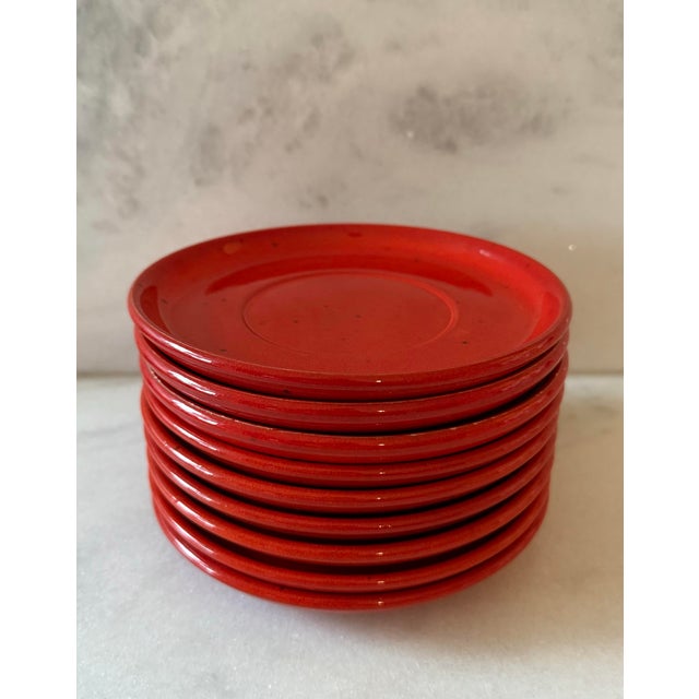 Set of 9 vintage mid century Gerz Germany pottery saucers. Striking bright orangish red color with small brown flecks, no...