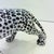 Unique handmade statue of a snow leopard. This Hollywood Regency statue, crafted from hand-painted ceramic and made in...
