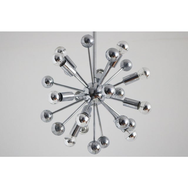 Impressive Italian Space Age Sputnik chandelier, attributed to Goffredo Reggiani, dating from the 1970s. Crafted from...
