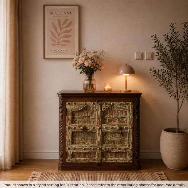 Invite the soul of a bygone era into your home with this breathtaking 1900s Antique Door Upcycled Cabinet. This stunning...