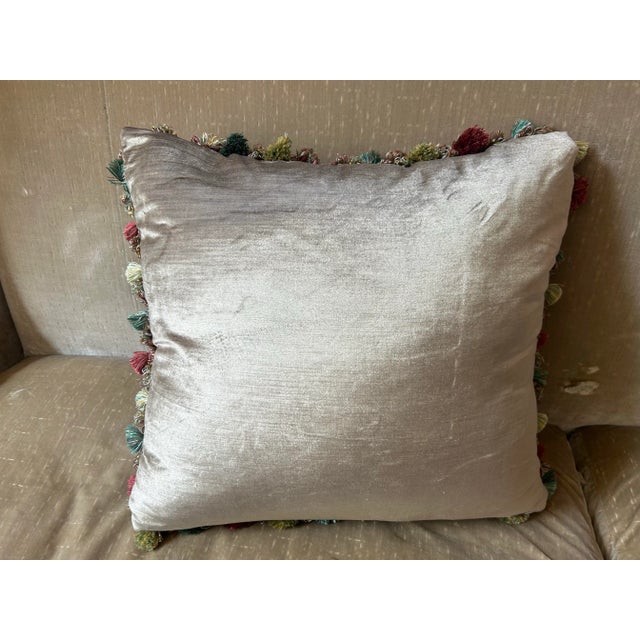 A pillow made from iconic Bevilacqua silk velvet Ikat, embellished with vintage tassel fringe and backed with coordinated...