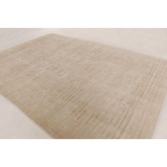 This oversized 10x14 contemporary rug is a refreshing addition to Rug & Kilim’s Modern Textural collection—a minimalist,...