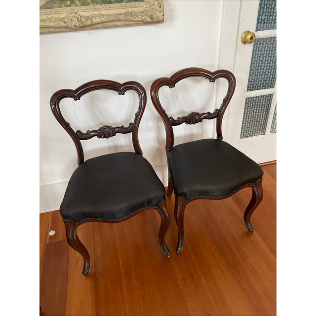 Set of Antique Victorian Rosewood Balloon Back Chairs Pair with Carved Central Splats and Central Scroll Details. The...