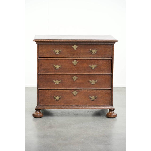 Offered by ByThijs: this very beautiful antique English 17th-century oak commode/chest of drawers with original fittings...