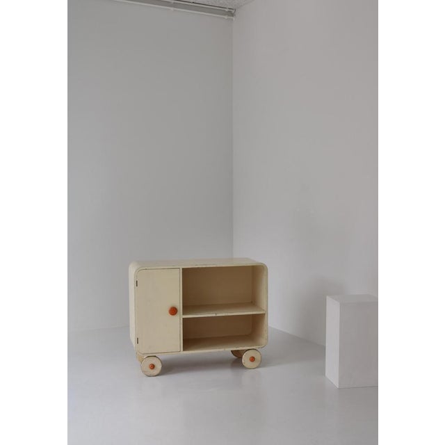 Unique early modernist sideboard made in the 1930s Scandinavia. The sideboard stand on wooden casters and can be moved...