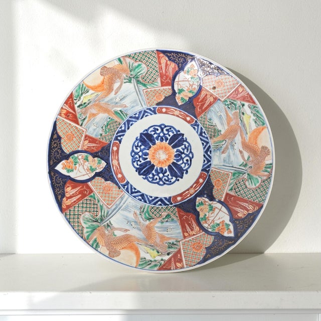 Large Japanese Imari porcelain charger produced in Arita during the late Meiji period, circa 1880–1900. The design...