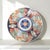 Large Japanese Imari porcelain charger produced in Arita during the late Meiji period, circa 1880–1900. The design...