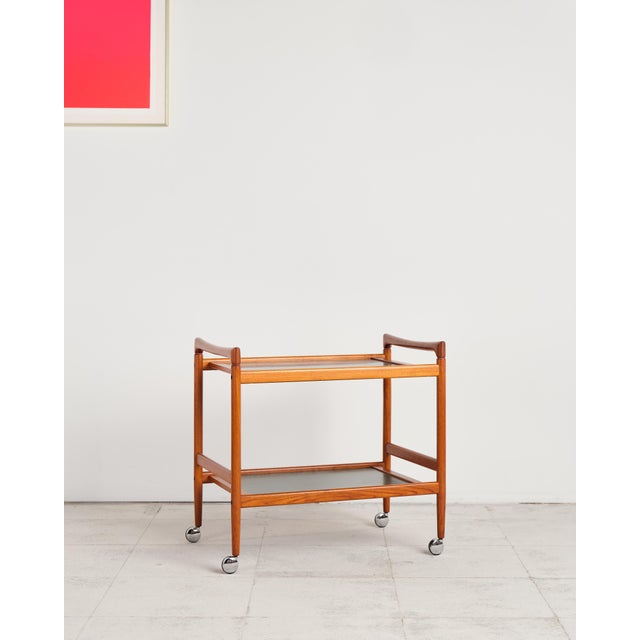 Dimensions: approx. 75 × 48 × 72 cm (width × depth × height of frame) This elegant serving trolley, produced by Dyrlund in...