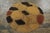 Hand knotted in wool and originating from Europe, circa 1950-1960, this 4x4 vintage circle rug enjoys an intricate, yet...