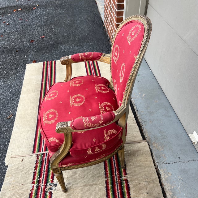 A Vintage Red Upholstered Painted Decorated and Carved French Bergere Arm Chair For Sale - Image 9 of 12