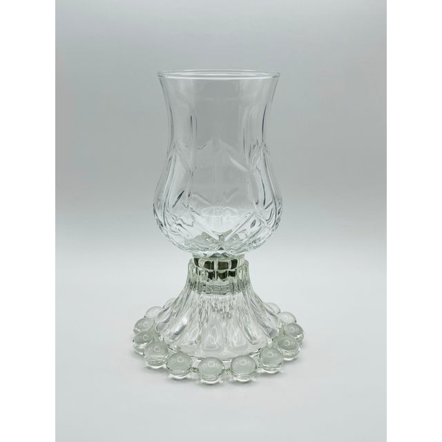 A charming hurricane style mid century candle lamp, great for adding cozy candlelight in a safe and beautiful way.