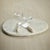 A solid slab of white marble with its smooth, substantial design features an ample, free form accentuated by natural,...