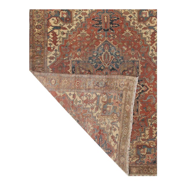 Antique Serapi rug. Hand-knotted in fine lambswool. This rug’s handmade, hand-knotted construction adds durability to this...