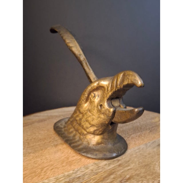 This listing features a heavy antique cast iron tabletop mechanical nutcracker sculptural casing modeled in the form of an...