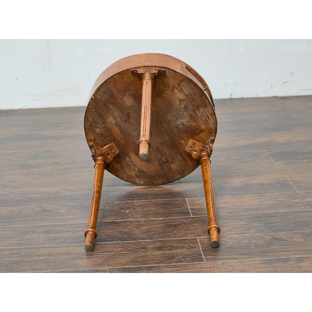 Crafted in France during the late 18th century, this Louis XVI walnut side table presents a refined neoclassical...