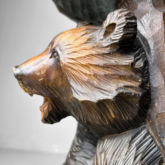 Solid wood stand, handcrafted by the Ainu people of Hokkaido, Japan. Dimensions: Height 48 cm, Diameter 29 cm. The base...