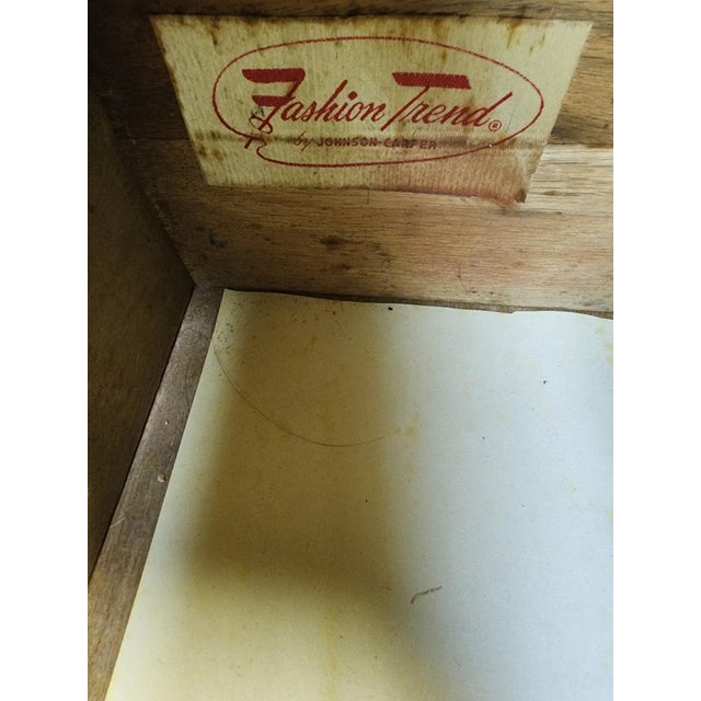 DESCRIPTION: Beautiful and distinctive Mid-Century Modern walnut lowboy dresser by Johnson Carper, featuring sculpted...